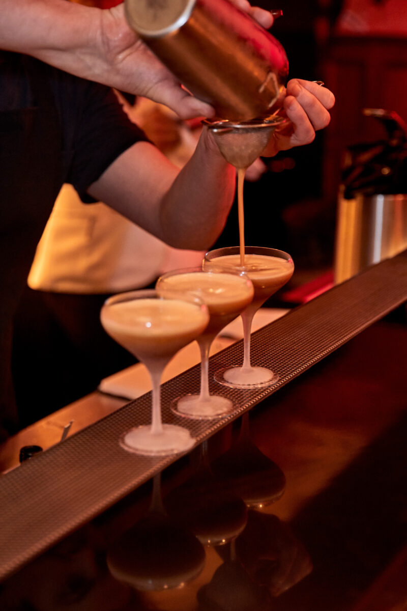Max Venning making cocktail with coca cola signature mixers herbal at Kwant london Heddon street