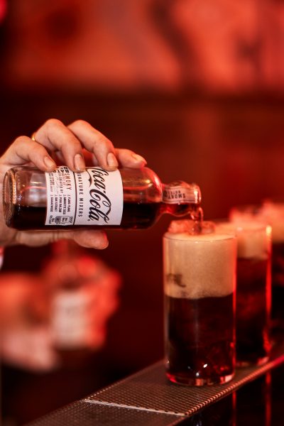 Coca-cola-signature-mixers-pour-cocktail wth ice dark bar kwant london bratislava photographer
