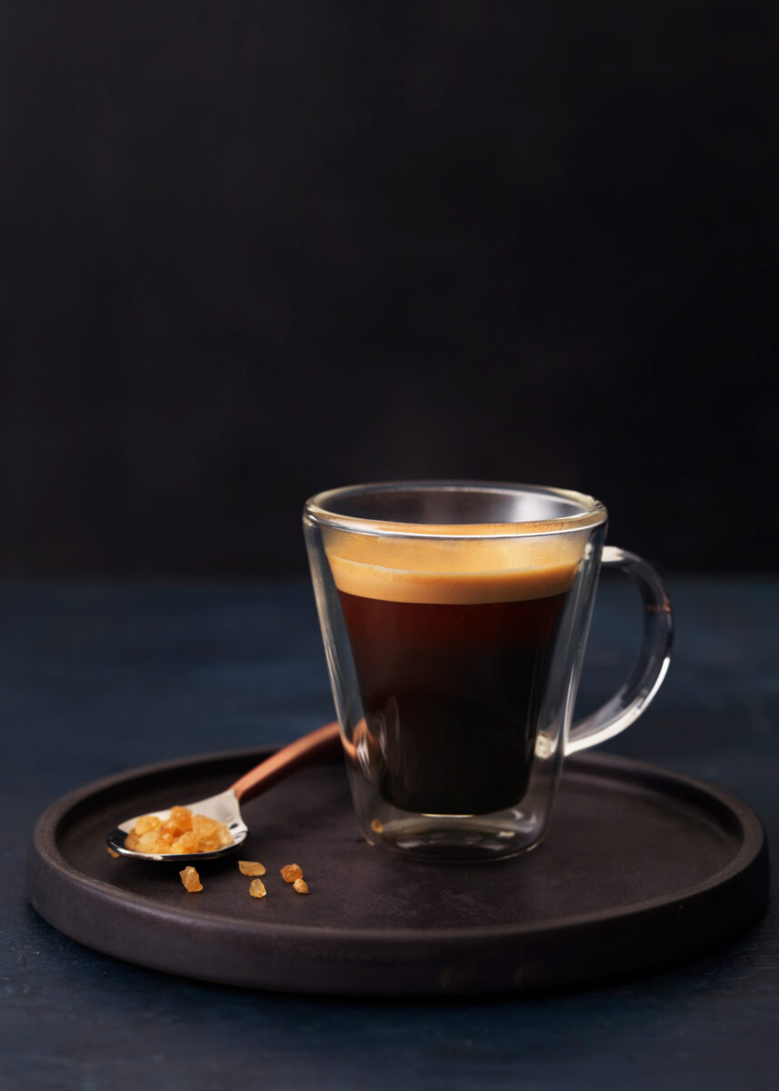 styled coffee espresso shot on dark background shallow dof with sugar drink photographer london bratislava