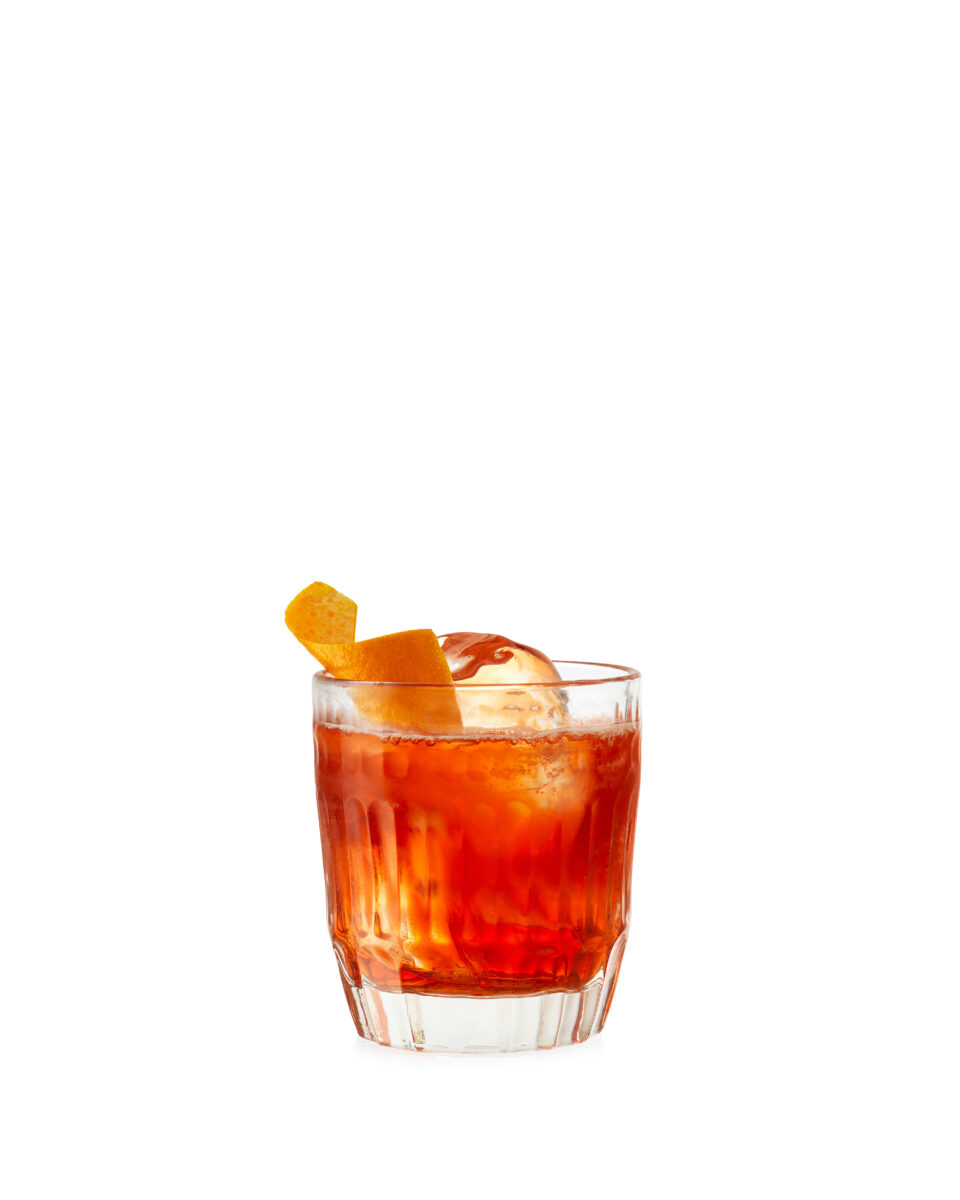 negroni cocktail on white background with ice and orange peel refreshing fotograf drinkov london bratislava profoto